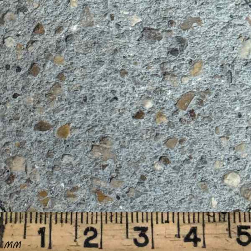 Close-up of GM272 Grey Lime Putty Mortar sample with ruler for scale – a medium grey colour